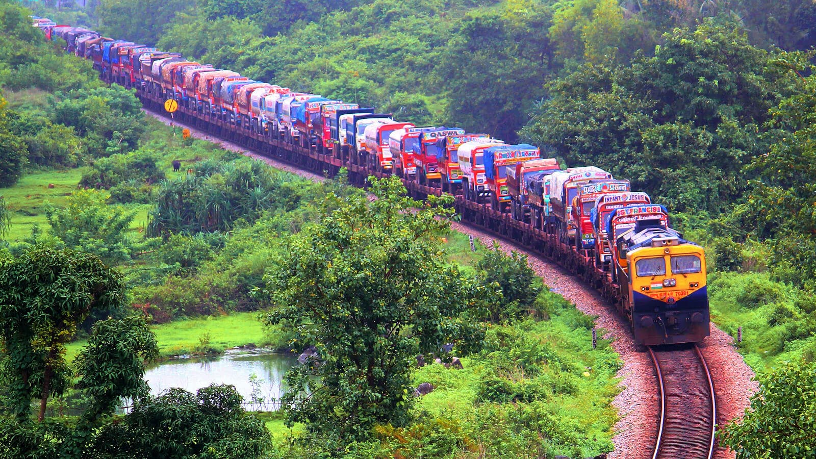 Cargo train crossing a majestic bridge